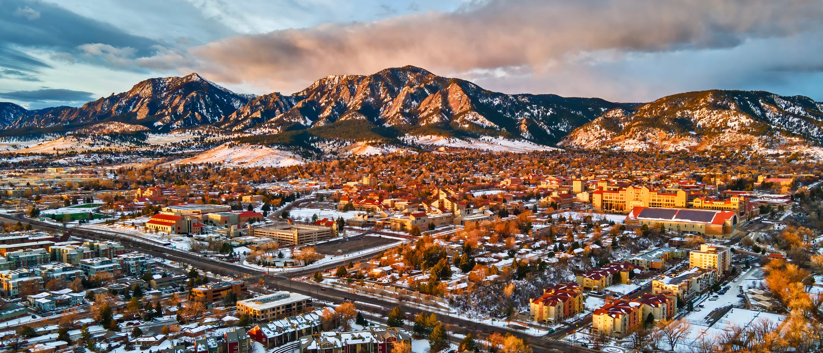 Boulder, Colorado cityscape with mountains, representing company location